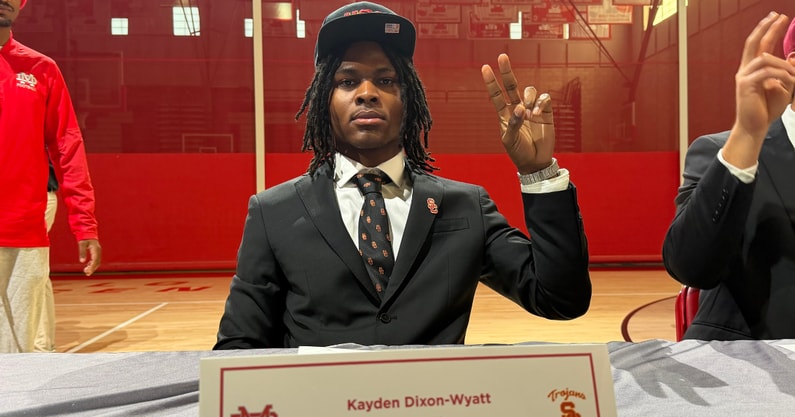 Kayden Dixon-Wyatt flashes the fight on after signing with the USC Trojans on national signing day