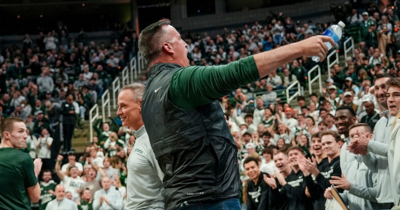 Michigan State's new football coach Pat Fitzgerald hypes up the Izzone before the Spartans basketball game against Iowa on Tuesday, Dec. 2, 2025, at the Breslin Center in East Lansing. - Nick King, USA TODAY Sports