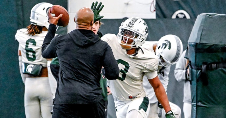 Michigan State defensive back Jeremiah Hughes, center, runs a drill during football practice on Tuesday, April 8, 2025, in East Lansing. - Nick King, USA TODAY Sports