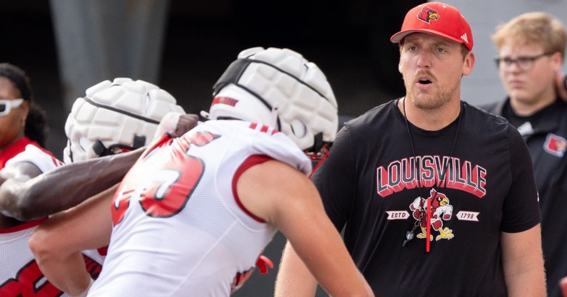 University of Louisville tight ends coach Ryan Wallace runs a drill during their second practice on Friday, Aug. 2, 2024 at L&N Federal Credit Union Stadium.