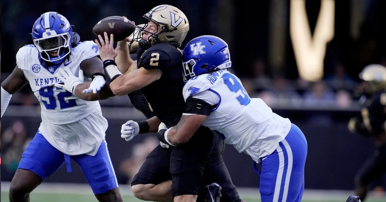 Vanderbilt quarterback Diego Pavia (2) is brought down from behind by Kentucky defensive lineman Mi'Quise Humphrey-Grace (90) during the second quarter at FirstBank Stadium in Nashville, Tenn., Saturday, Nov. 22, 2025. (© Mark Zaleski / The Tennessean / USA TODAY NETWORK via Imagn Images)