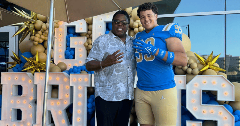 Recruit Marcus Almada and UCLA DL coach Jethro Franklin