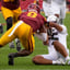 Dante Moore suffers concussion, flew back with team after game