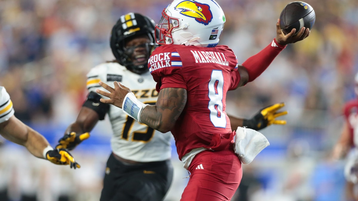 Kansas Jayhawks quarterback Isaiah Marshall (8) throws the ball against Missouri Tigers during the game inside David Booth