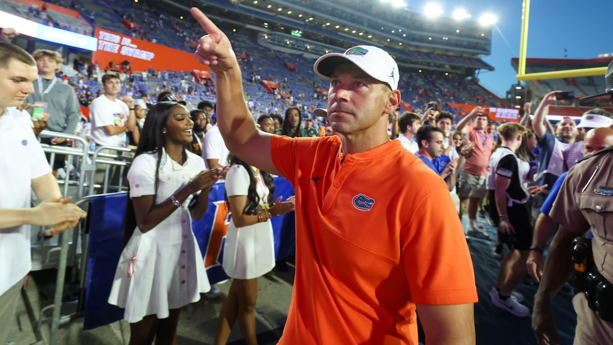 Florida head coach Jon Sumrall reacts to fans after Florida beat Ole Miss 52-28 after the second half an NCAA football game