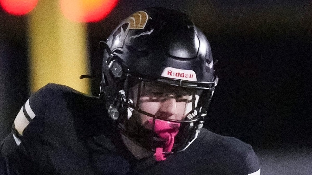 Paramus Catholic sophomore Walker Snee (13) runs with the ball as DePaul defends during a game at Paramus Catholic high school,