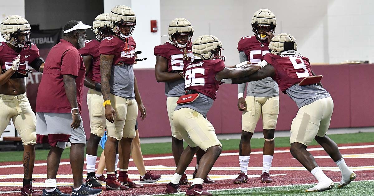 Florida State defensive line coach Odell Haggins working with his players.