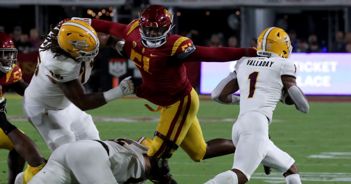Arizona State running back X Valladay slips past the grasp of USC defensive lineman Solomon Byrd in the first quarter at the Los Angeles Memorial Coliseum on Saturday night, Oct. 1, 2022. (Luis Sinco / Los Angeles Times via Getty Images)
