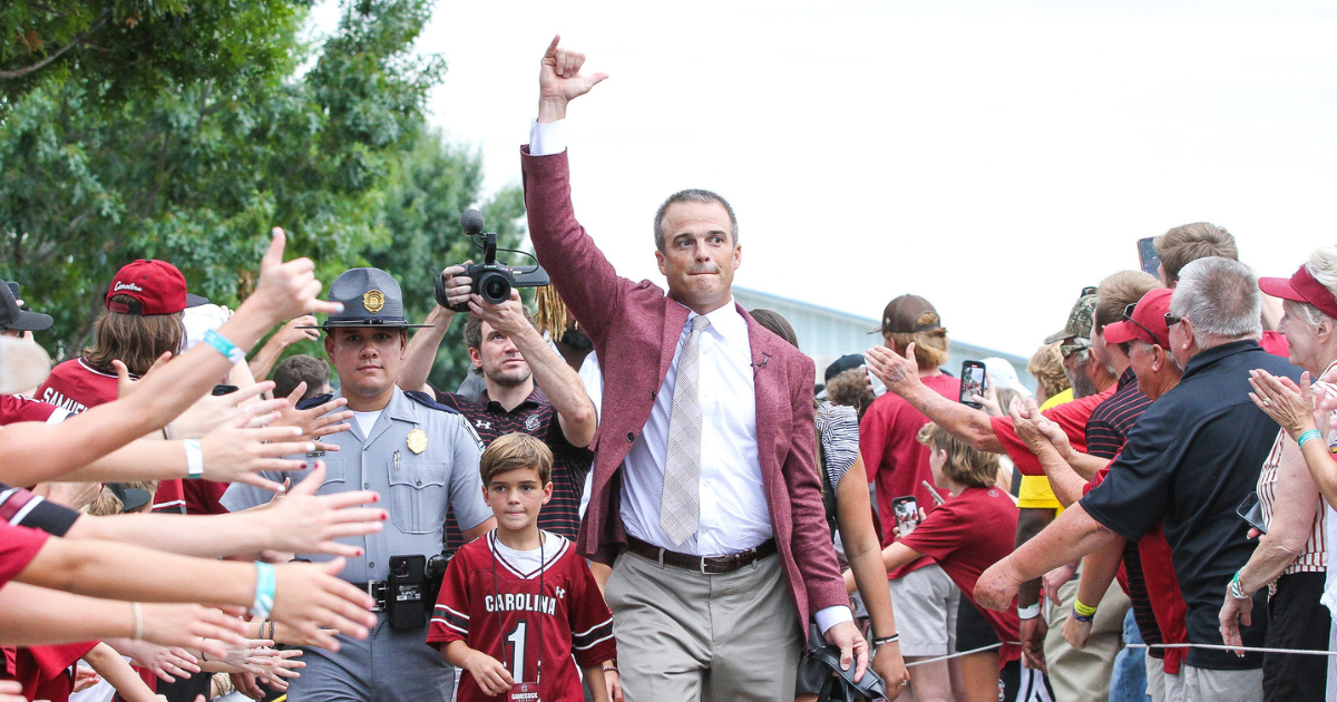 South Carolina head coach Shane Beamer pumps up fans during Gamecock Walk pregame