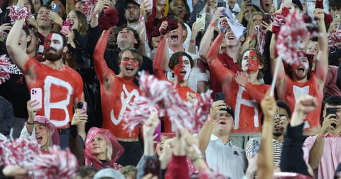 Alabama fans throw objects at Georgia players near tunnel, staffers urge players to wear helmets