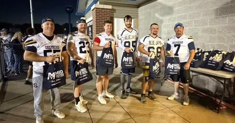 Michigan high school football team faces group of dads in flag to save homecoming game