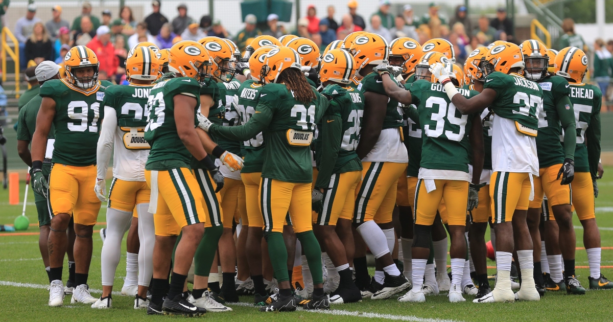 Jack Heflin of the Green Bay Packers walks off the field after the News  Photo - Getty Images