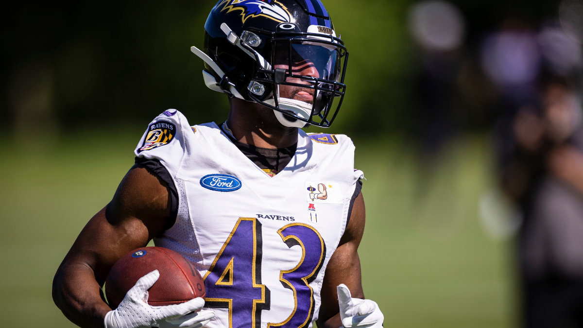 Baltimore Ravens running back Gus Edwards runs with the ball during News  Photo - Getty Images