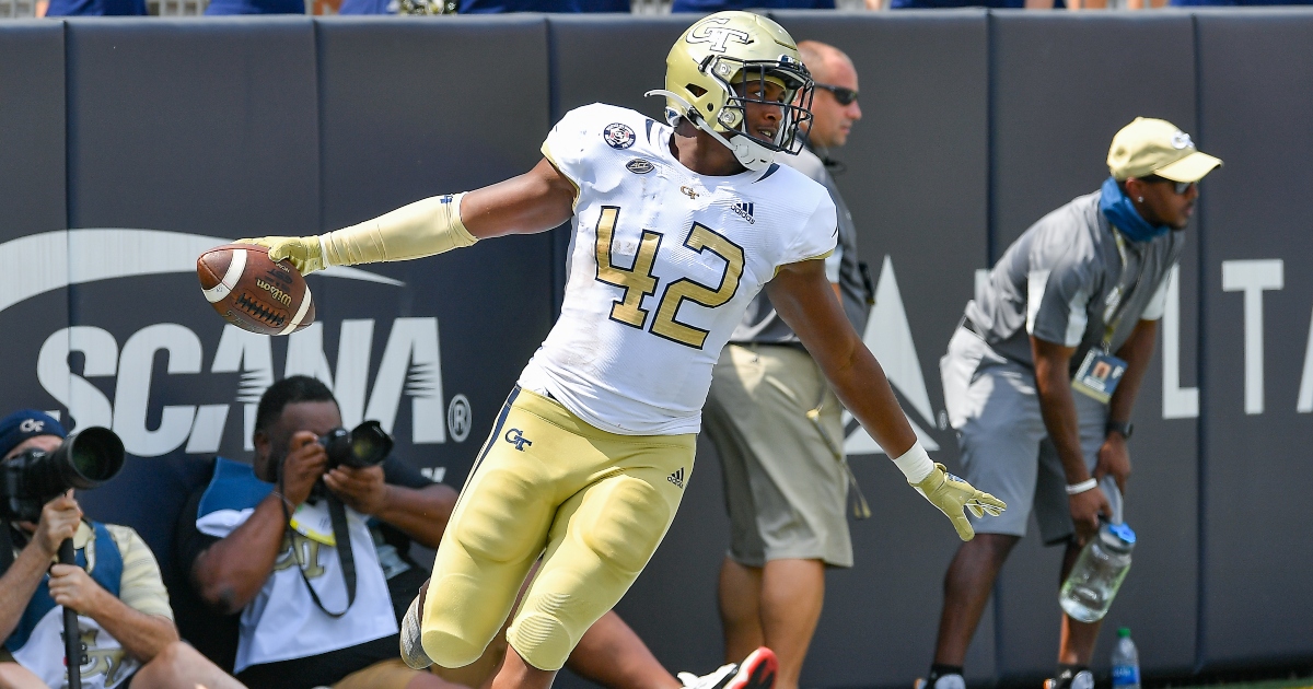 WATCH Defensive end stiff arms tackler, teammate into another for 70