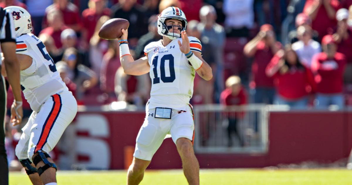 Arlington, TX U.S. 31st Aug, 2019. A Auburn Tigers quarterback Bo Nix (10)  game stats 13 for 31 for 177 yards and 2 touchdowns rolls out of the pocket  during the NCAA