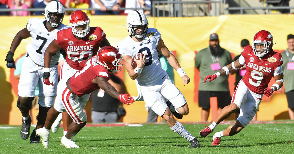 Christian Veilleux runs with football