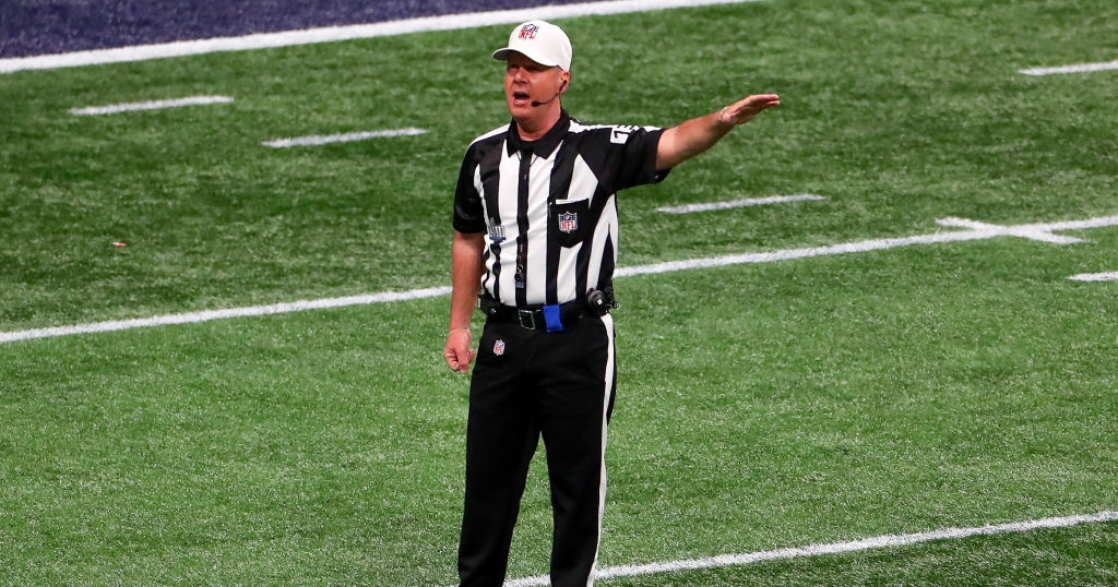 NFL referees attempt to stop a fight between the Los Angeles Rams