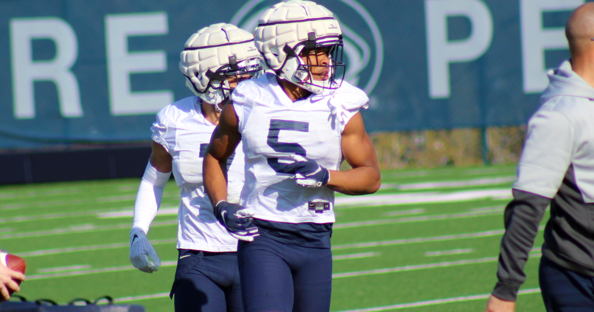 Penn State Wide Receiver, Mitchell Tinsley, jogging between reps at spring practice.