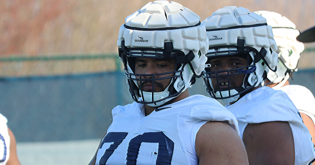 Penn State offensive lineman Juice Scruggs listens to his coach