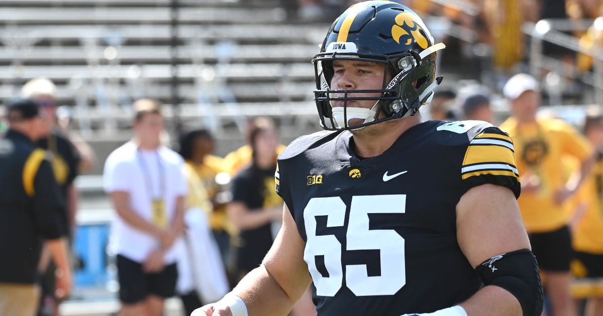 Center Tyler Linderbaum of the Baltimore Ravens looks on before