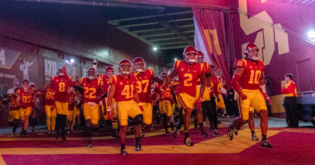 The USC Trojans run out of the Los Angeles Memorial Coliseum tunnel before a football game against the Fresno State Bulldogs