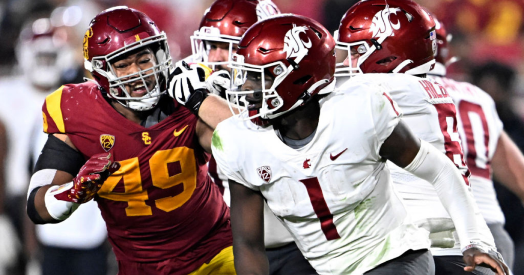 USC defensive lineman Tuli Tuipulotu puts pressure on Washington State quarterback Cameron Ward during a game between the Trojans and Cougars