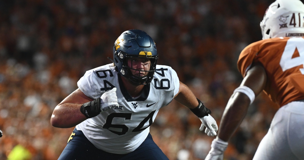 West Virginia starting tackle Wyatt Milum helped off field with leg