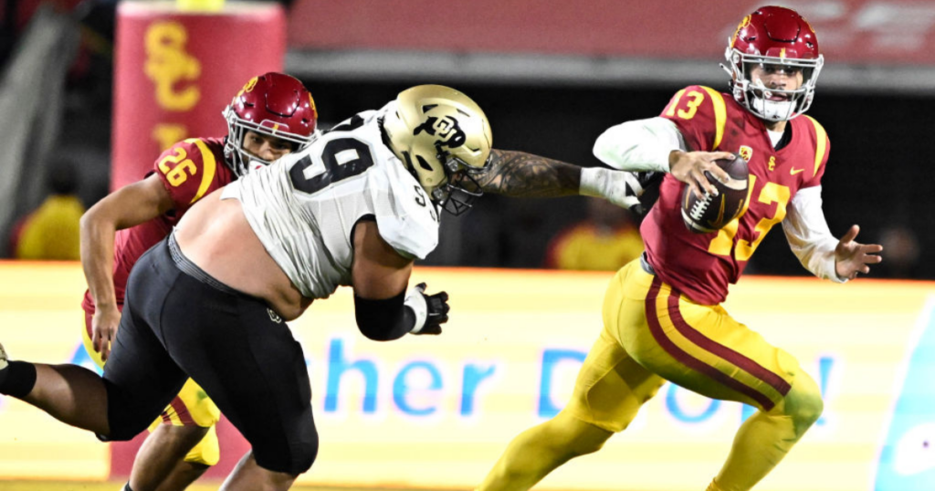 Quarterback Caleb Williams #13 of the USC Trojans scrambles for yardage against the Colorado Buffaloes