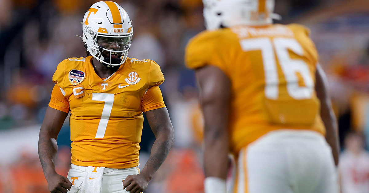 Tennessee quarterback throws orange length of football field.