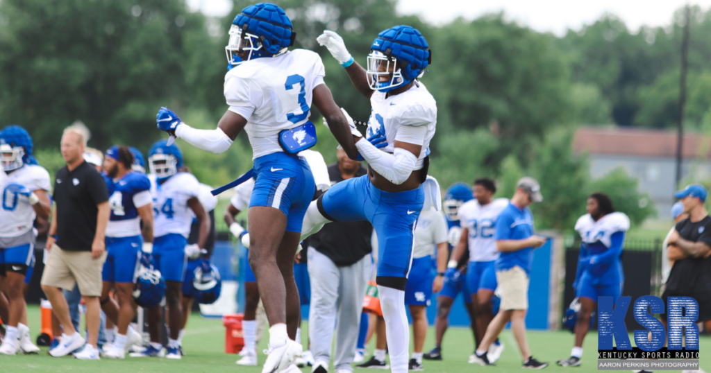 Kentucky's Alex Afari and Andru Dru Phillips celebrate a play at practice