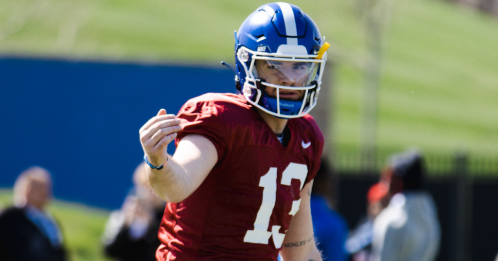 Kentucky QB Devin Leary motions a wide receiver at spring practice