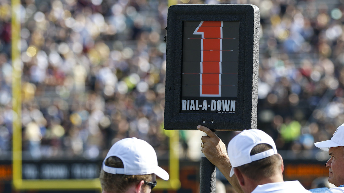 NCAA rules panel approves keeping clock running on college football first  downs