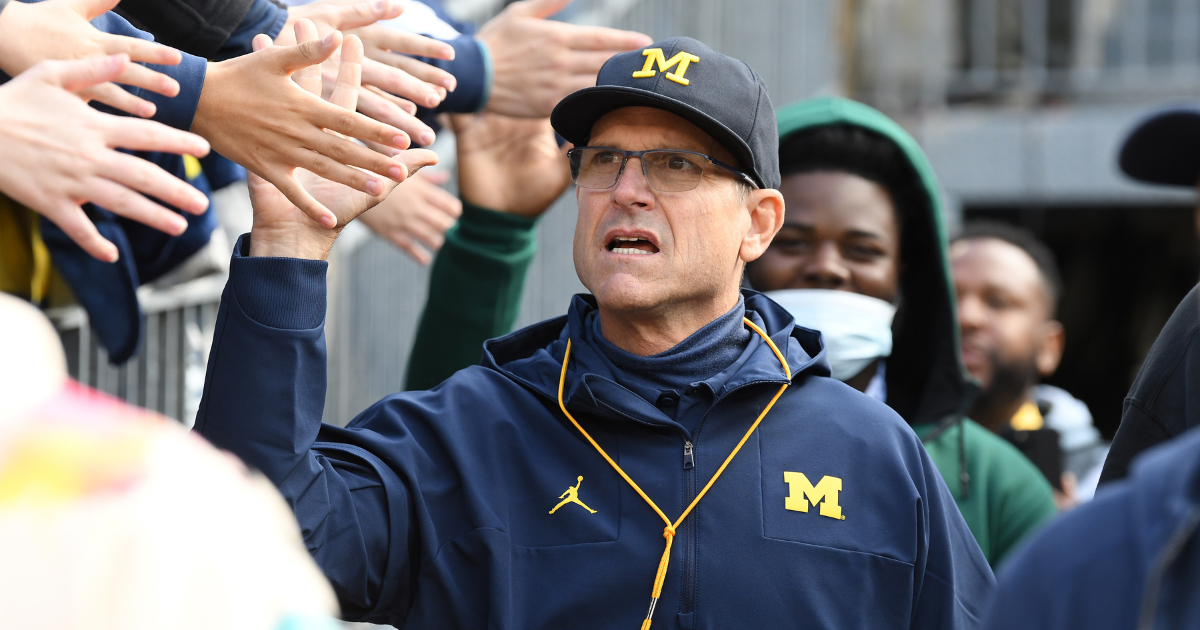 Michigan quarterback J.J. McCarthy warms up in 'Free Harbaugh' shirt after  suspension