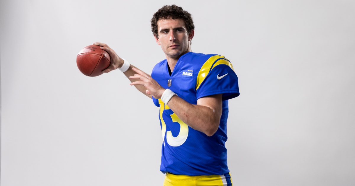 Quarterback Stetson Bennett of the Los Angeles Rams hands the ball News  Photo - Getty Images