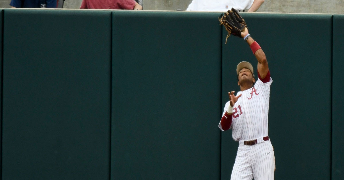 Alabama right fielder Andrew Pinckney guns down Kentucky runner at home plate in 2023 SEC Baseball Tournament