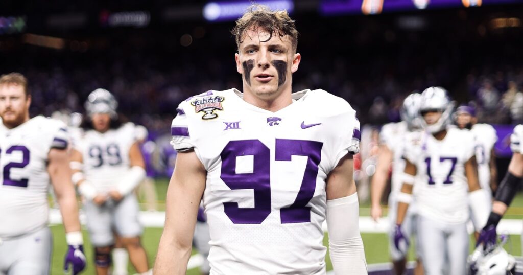 Kansas State defensive end Nate Matlack walks off the field