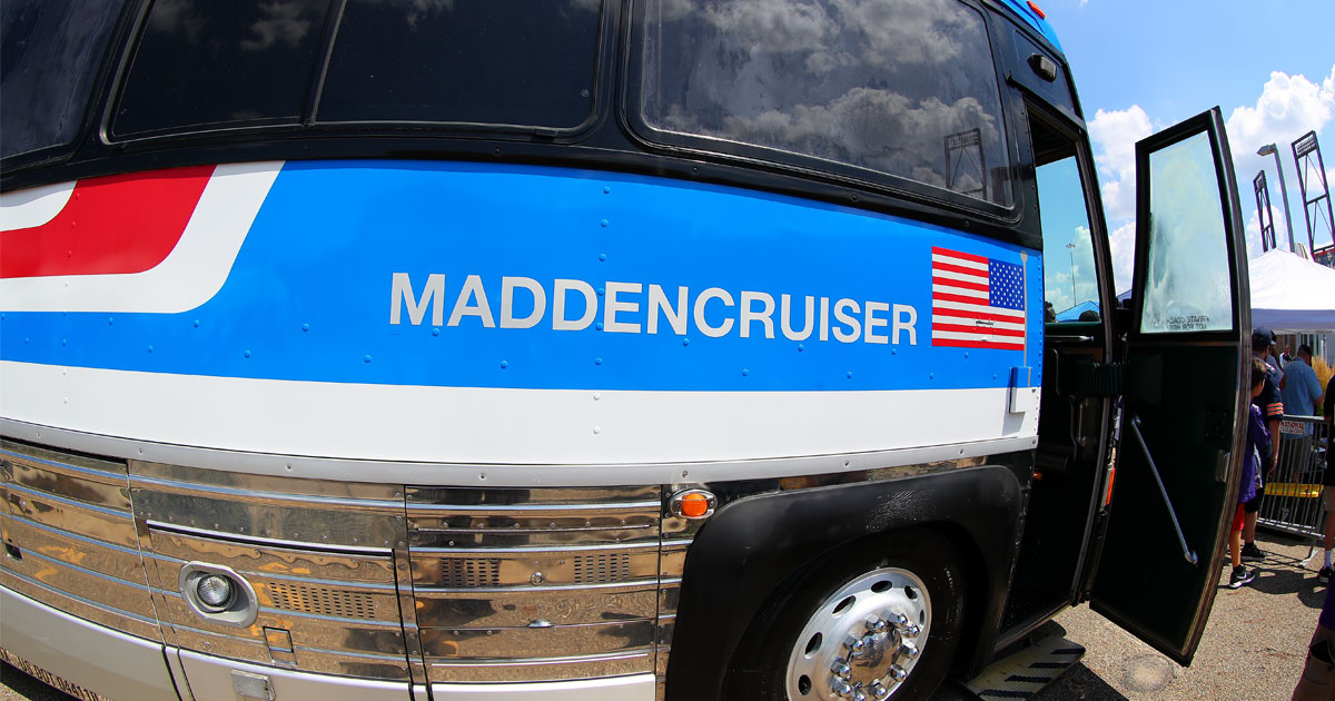 Footballs decorate the window sill of the 'Madden Cruiser, the bus of pro  football hall of fame coach John Madden, as it leaves the National Football  League offices with Madden and NFL