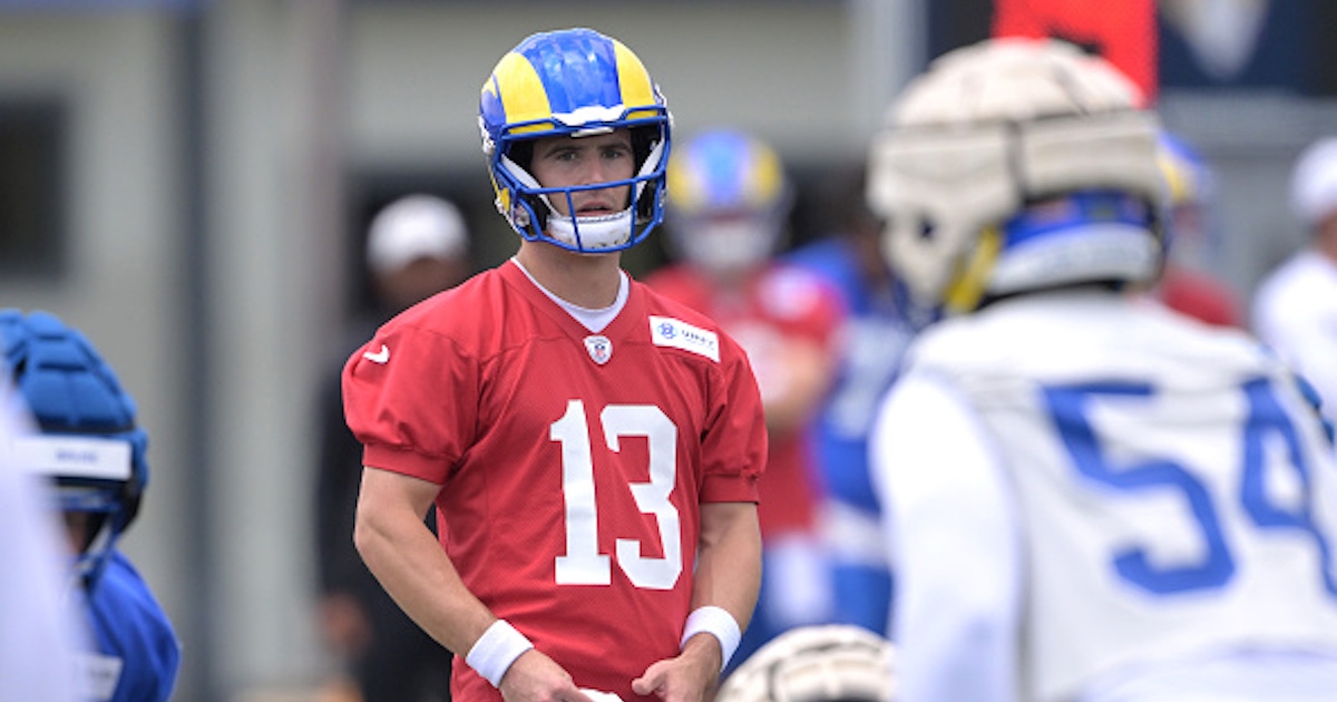 Quarterback Stetson Bennett of the Los Angeles Rams hands the ball News  Photo - Getty Images