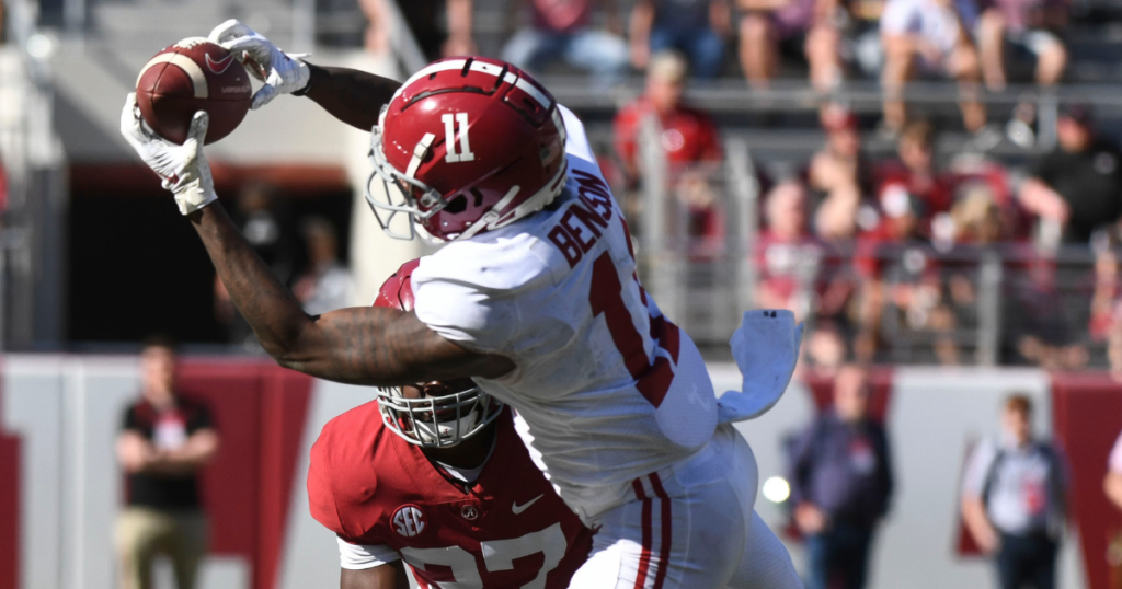 Apr 22, 2023; Tuscaloosa, AL, USA; White team wide receiver Malik Benson (11) catches a pass with Crimson team defensive back Ty Roper (37) defending during the A-Day game at Bryant-Denny Stadium.