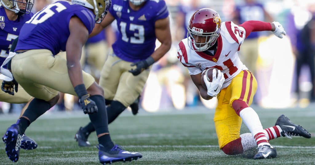 USC Trojans wide receiver Tyler Vaughns finds himself surrounded by the Washington Huskies defense