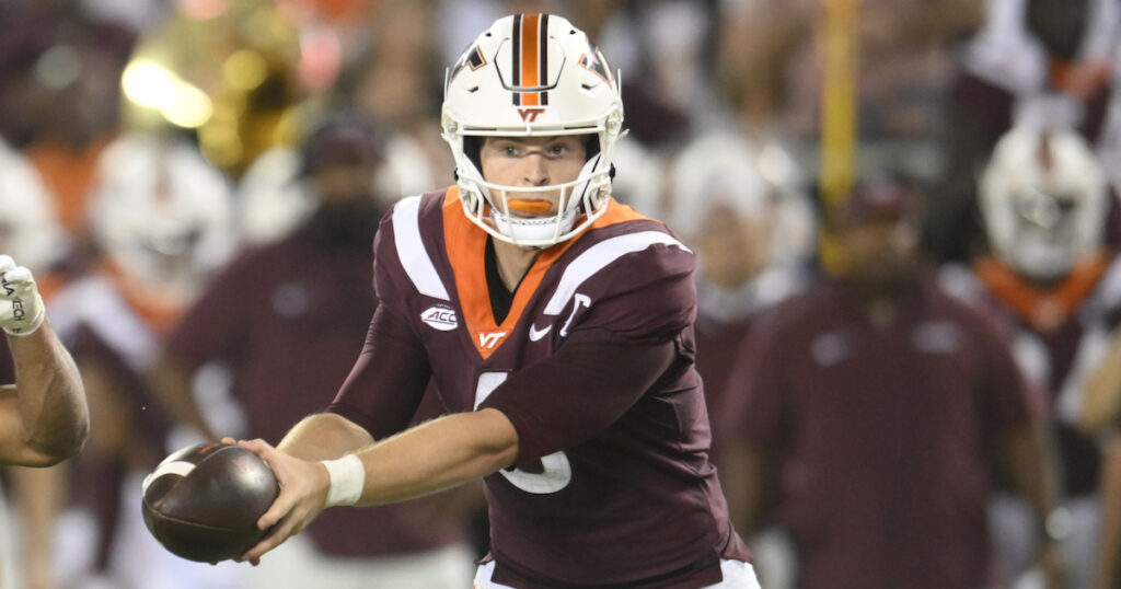 Virginia Tech Hokies quarterback Grant Wells hands off ball