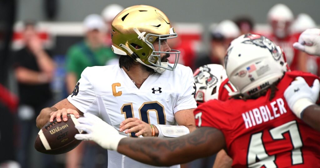 Notre Dame Fighting Irish quarterback Sam Hartman looks to pass