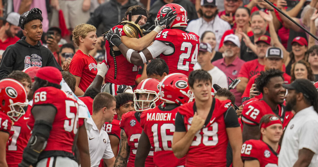 Georgia Bulldogs defensive back Dan Jackson reacts with defensive back Malaki Starks