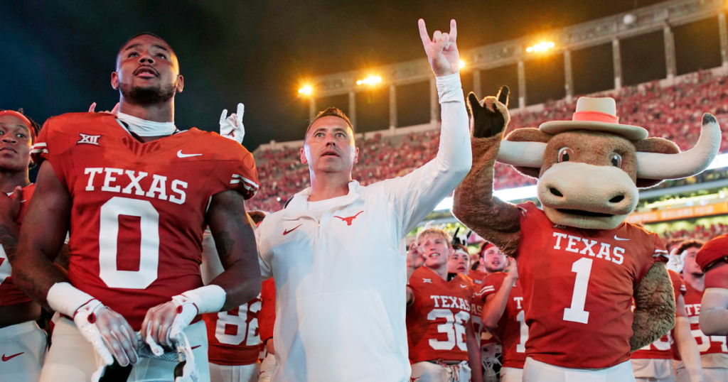 Sep 16, 2023; Austin, Texas, USA; Texas Longhorns head coach Steve Sarkisian acknowledges fans with tight end Ja'Tavion Sanders (0) and the team mascot Hook Em after a victory over the Wyoming Cowboys at Darrell K Royal-Texas Memorial Stadium.