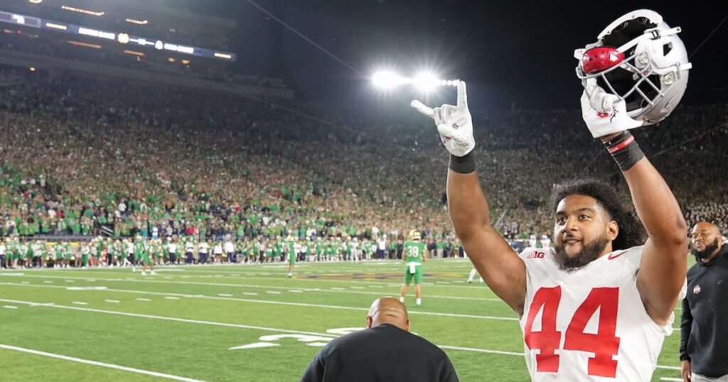Ohio State Buckeyes defensive end JT Tuimoloau celebrates after beating Notre Dame