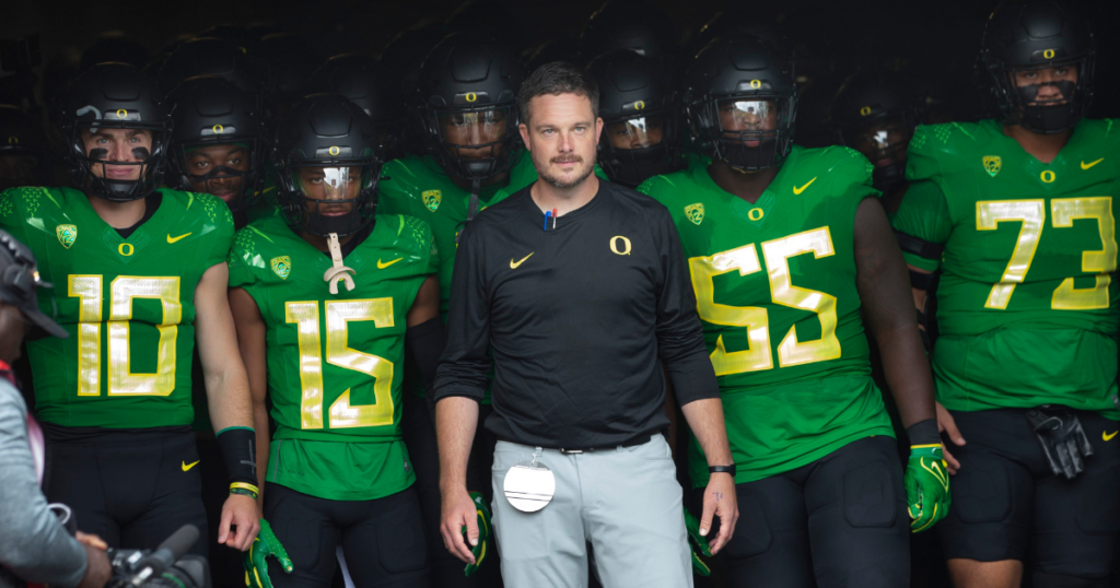 Oregon coach Dan Lanning leads his team onto the field before the game against Colorado in Eugene Saturday, Sept. 23, 2023.