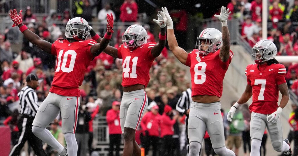 Ohio State Buckeyes safety Lathan Ransom celebrates with Ohio State Buckeyes cornerback Denzel Burke and Ohio State Buckeyes safety Josh Proctor 