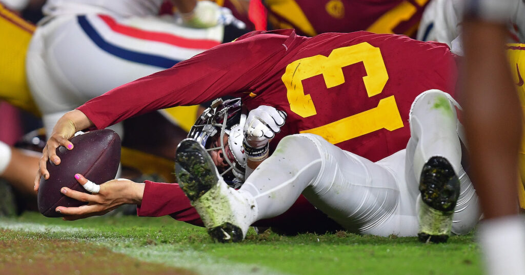 USC Trojans quarterback Caleb Williams reaches into the endzone