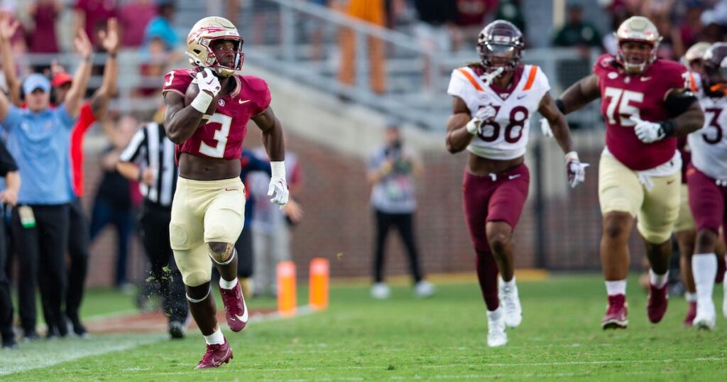 Florida State Seminoles running back Trey Benson makes his way down the field for a touchdown.