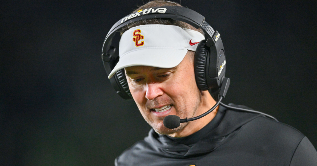 USC Trojans head coach Lincoln Riley talks on his headset in the third quarter against the Notre Dame Fighting Irish at Notre Dame Stadium